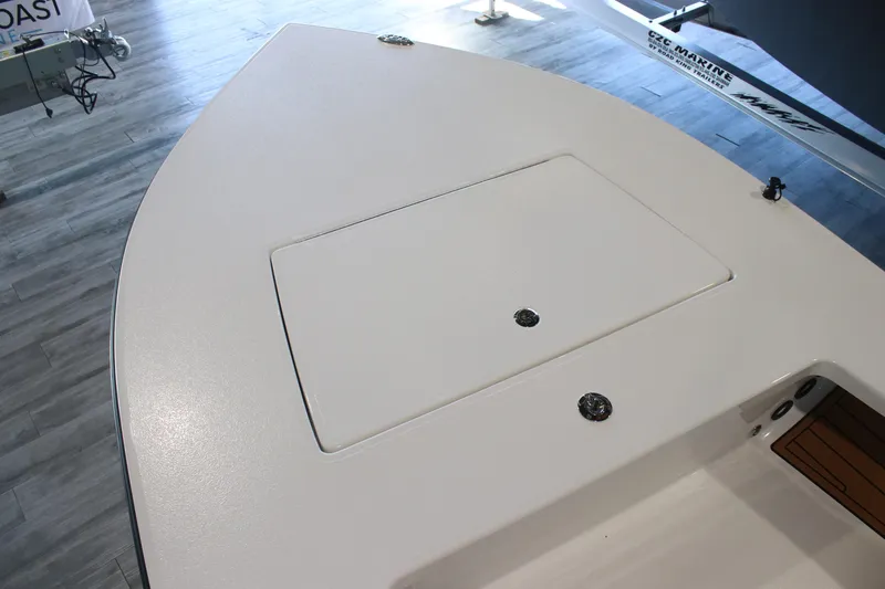 Slide: The Image of 2026 East Cape Vantage boat deck with storage compartment, displayed indoors. - 6