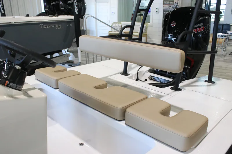 Slide: The Image of 2026 East Cape Vantage boat interior with beige seating and Mercury Pro engine. - 7
