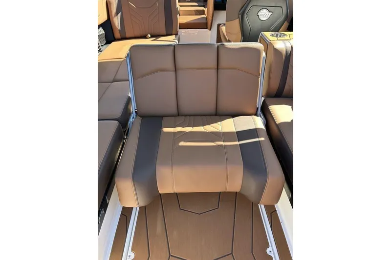 Slide: The Image of 2026 Malibu Sunscape 25 LSV boat interior with luxurious brown leather seating. - 11
