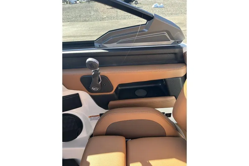 Slide: The Image of 2026 Malibu Sunscape 25 LSV interior with tan leather seating and sleek design. - 19