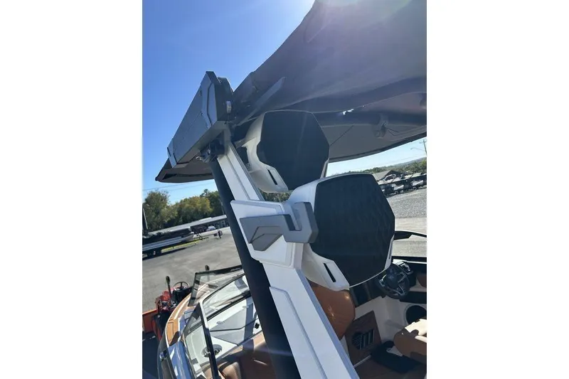 Slide: The Image of 2026 Malibu Sunscape 25 LSV boat with advanced speaker system and sleek design. - 26