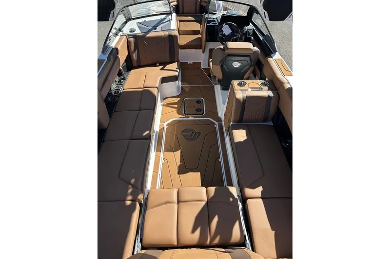 Slide: The Image of Luxurious interior of 2026 Malibu Sunscape 25 LSV boat with tan seating and modern design. - 9