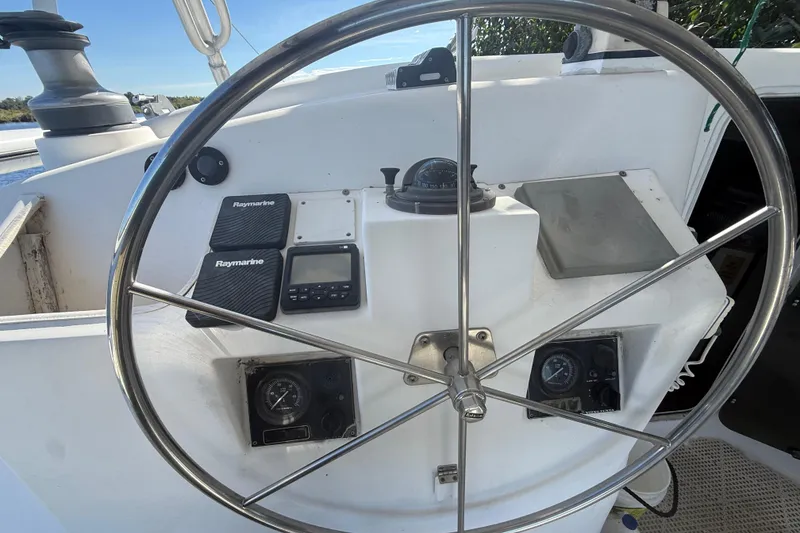 Slide: The Image of Steering wheel and navigation instruments on 1995 Manta Sailing Catamaran. - 11