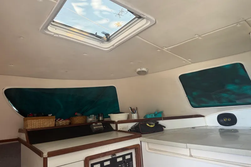 Slide: The Image of Interior of 1995 Manta Sailing Catamaran with skylight and storage baskets. - 24