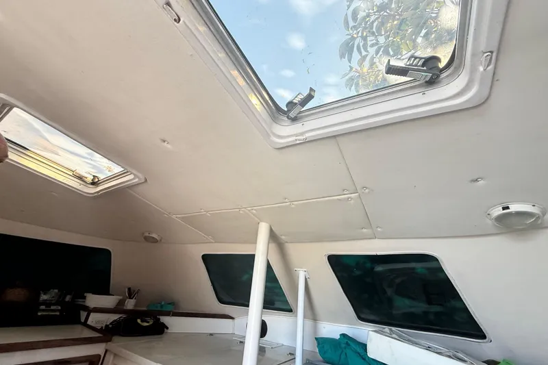 Slide: The Image of Interior view of 1995 Manta Sailing Catamaran with skylights and seating area. - 26