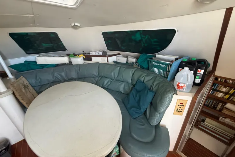 Slide: The Image of Interior of 1995 Manta Sailing Catamaran with curved seating and table. - 27