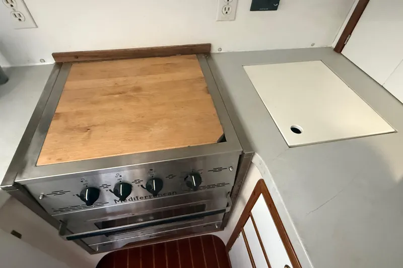 Slide: The Image of Galley kitchen in 1995 Manta SAILING CATAMARAN with stove and countertop. - 33