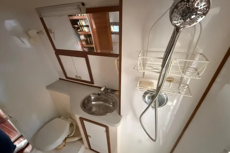 Slide: The Image of Bathroom interior of a 1995 Manta SAILING CATAMARAN with sink, shower, and toilet. - 39