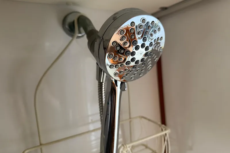 Slide: The Image of Showerhead in a 1995 Manta Sailing Catamaran bathroom, chrome finish, close-up view. - 40