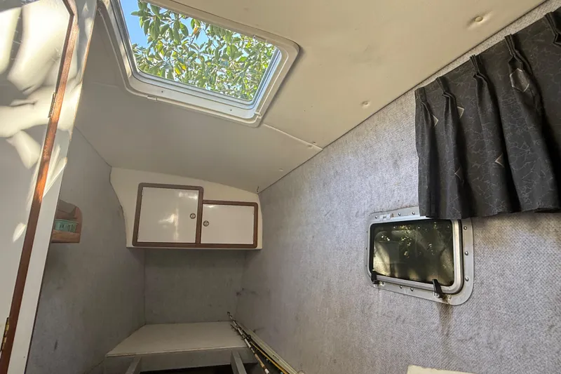Slide: The Image of Interior cabin of a 1995 Manta SAILING CATAMARAN with window and storage cabinets. - 41