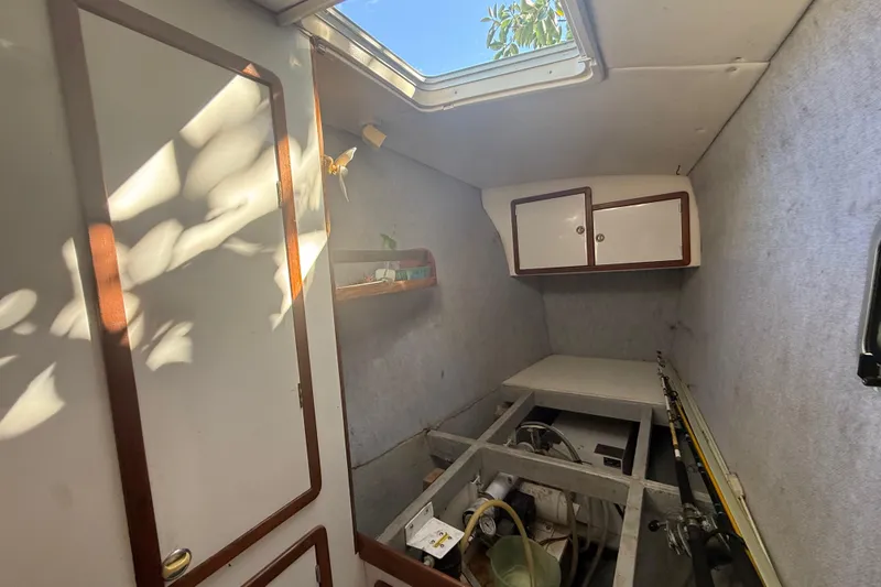 Slide: The Image of Interior of 1995 Manta SAILING CATAMARAN with storage and fishing rods. - 43
