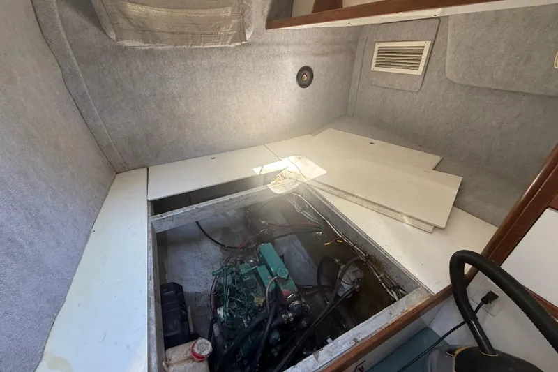 Slide: The Image of Interior of a 1995 Manta Sailing Catamaran showing engine compartment. - 50