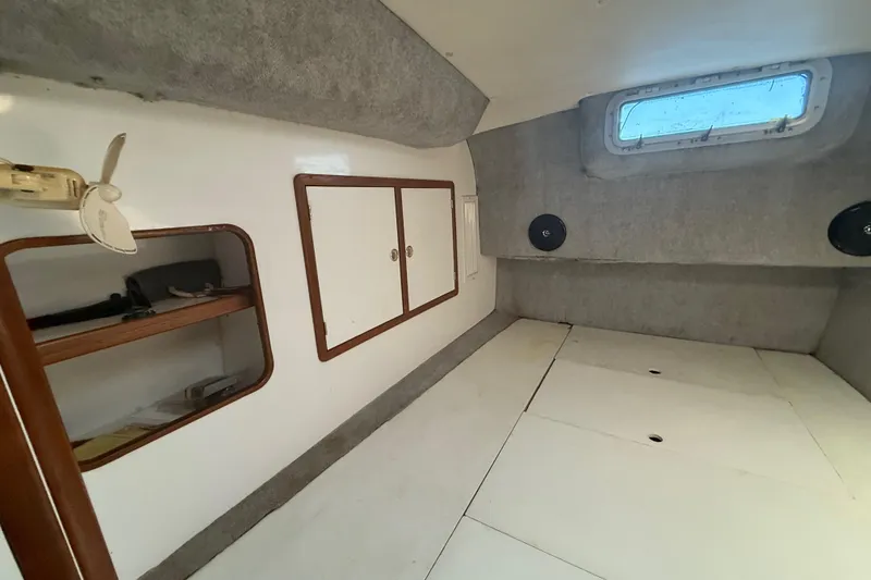 Slide: The Image of Interior of 1995 Manta Sailing Catamaran with storage and window. - 54