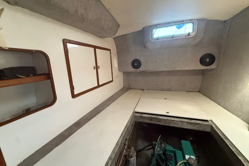 Slide: The Image of Interior of 1995 Manta Sailing Catamaran with engine compartment and storage cabinets. - 55
