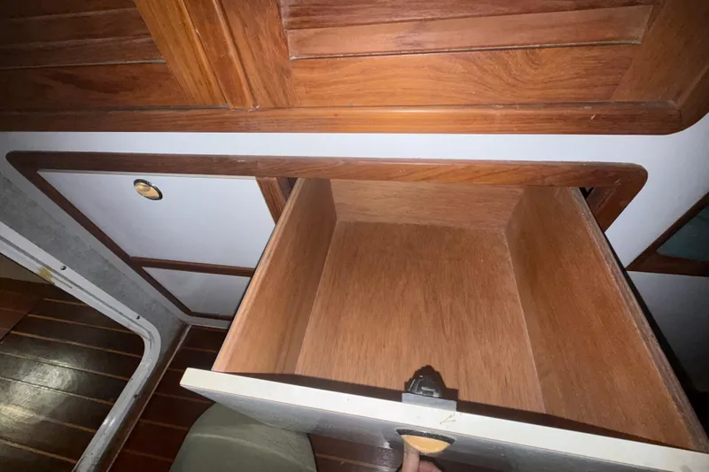 Slide: The Image of Open wooden drawer inside a 1995 Manta SAILING CATAMARAN, showcasing interior craftsmanship. - 58