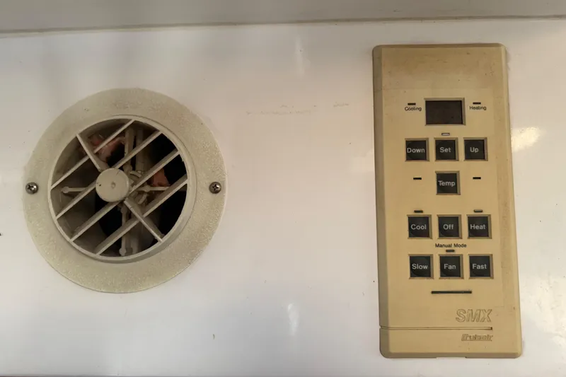 Slide: The Image of Control panel and vent on 1995 Manta SAILING CATAMARAN, featuring cooling and heating options. - 59
