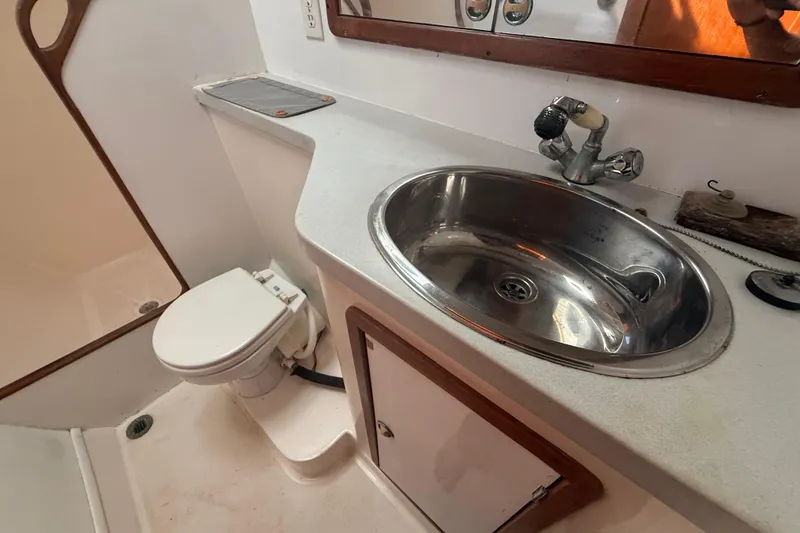 Slide: The Image of Bathroom interior of 1995 Manta SAILING CATAMARAN with sink and toilet. - 62