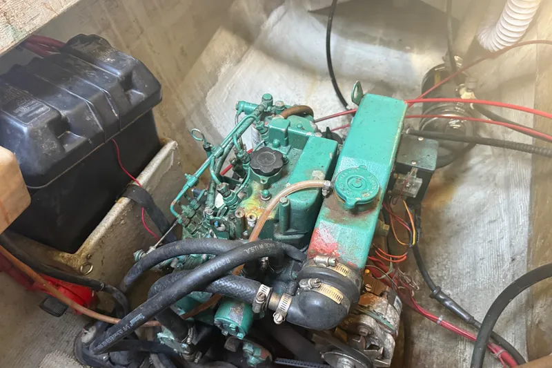 Slide: The Image of Engine compartment of a 1995 Manta SAILING CATAMARAN with visible battery and wiring. - 73