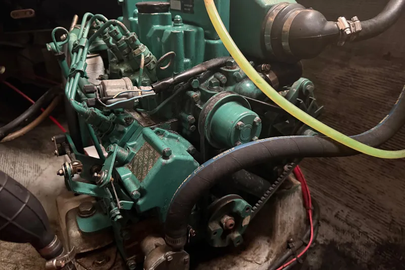 Slide: The Image of Engine of a 1995 Manta SAILING CATAMARAN with visible hoses and wiring. - 75