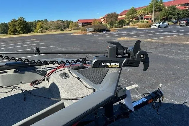 Slide: The Image of Bass Tracker 175 TF 2016 boat with Minn Kota trolling motor in a parking lot. - 6