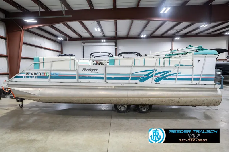 Slide: The Image of 1993 Avalon Playbouy Challenger pontoon boat in indoor storage, side view. - 10