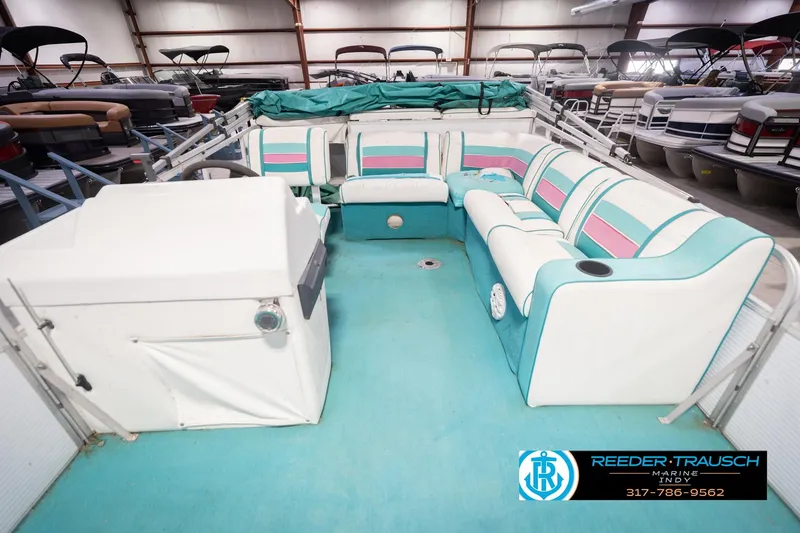 Slide: The Image of Interior of a 1993 Avalon Playbouy Challenger pontoon boat with colorful seating. - 16