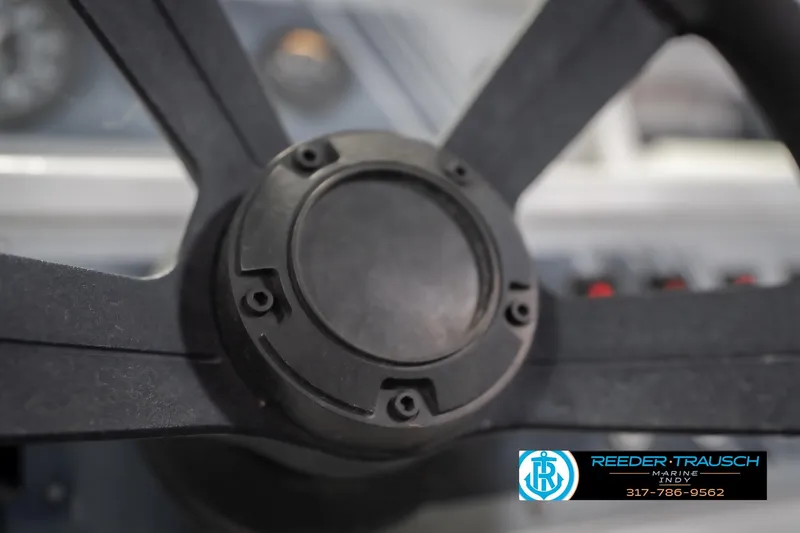 Slide: The Image of Steering wheel of a 1993 Avalon Playbouy Challenger boat, close-up view. - 29