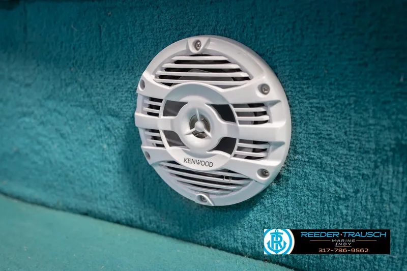 Slide: The Image of Kenwood speaker on 1993 Avalon Playbouy Challenger boat, teal interior, Reeder-Trausch Marine logo. - 37