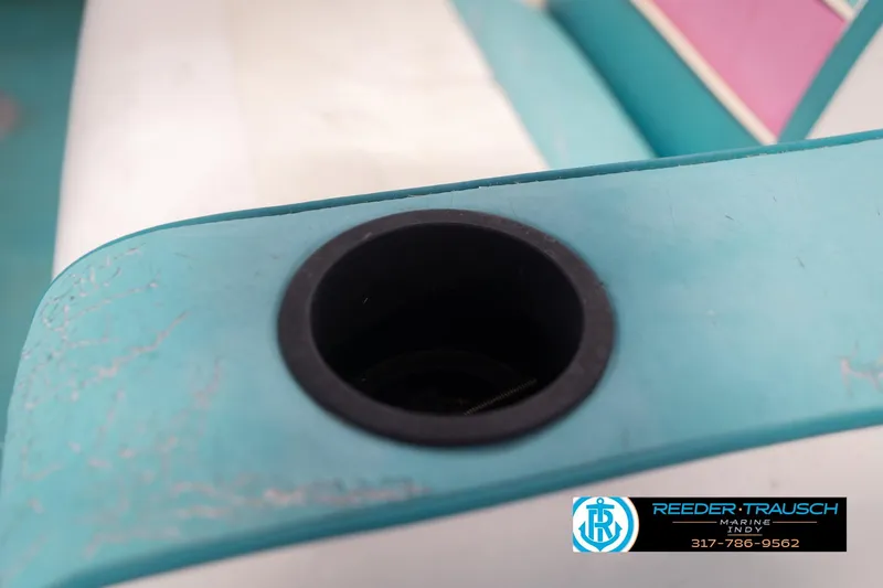 Slide: The Image of Close-up of a 1993 Avalon Playbouy Challenger boat seat with cup holder. - 38