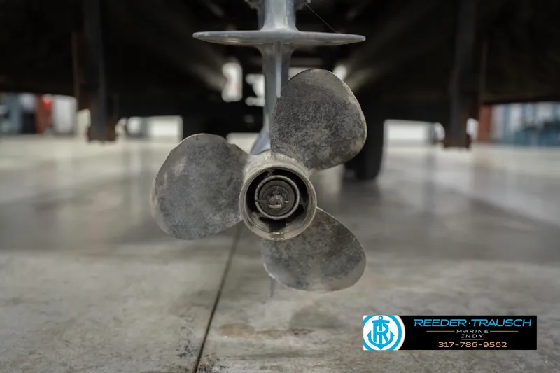 Slide: The Image of Propeller of 1993 Avalon Playbouy Challenger boat in a workshop setting. - 43