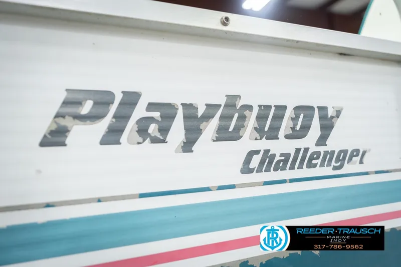 Slide: The Image of 1993 Avalon Playbouy Challenger boat with worn logo and Reeder-Trausch Marine contact details. - 44