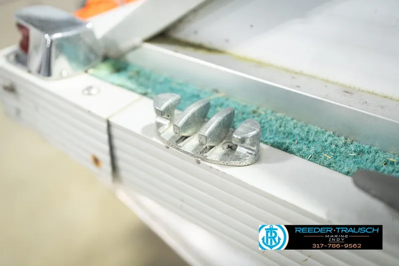 Slide: The Image of Close-up of a 1993 Avalon Playbouy Challenger boat cleat with textured surface. - 50