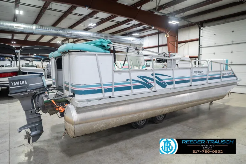 Slide: The Image of 1993 Avalon Playbouy Challenger pontoon boat with Yamaha motor in indoor storage. - 7