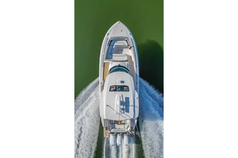 Slide: The Image of Aerial view of 2024 Tiara Yachts 38 LS cruising on water. - 11