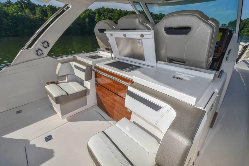 Slide: The Image of 2024 Tiara Yachts 38 LS interior with luxurious seating and modern amenities. - 18