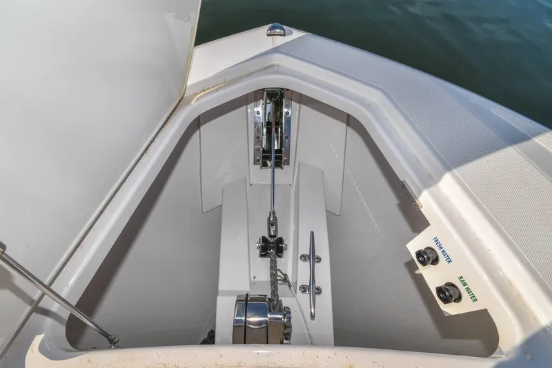 Slide: The Image of 2024 Tiara Yachts 38 LS anchor locker with fresh and raw water controls. - 19
