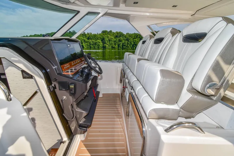Slide: The Image of 2024 Tiara Yachts 38 LS interior with luxurious seating and modern helm. - 20