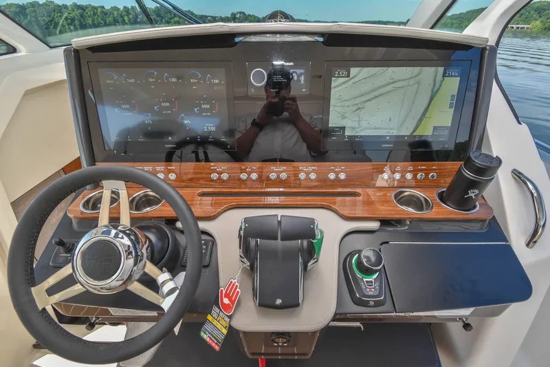 Slide: The Image of 2024 Tiara Yachts 38 LS helm with advanced navigation displays and controls. - 23