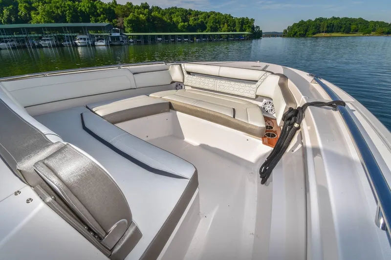 Slide: The Image of 2024 Tiara Yachts 38 LS luxury seating area on a serene lake. - 26