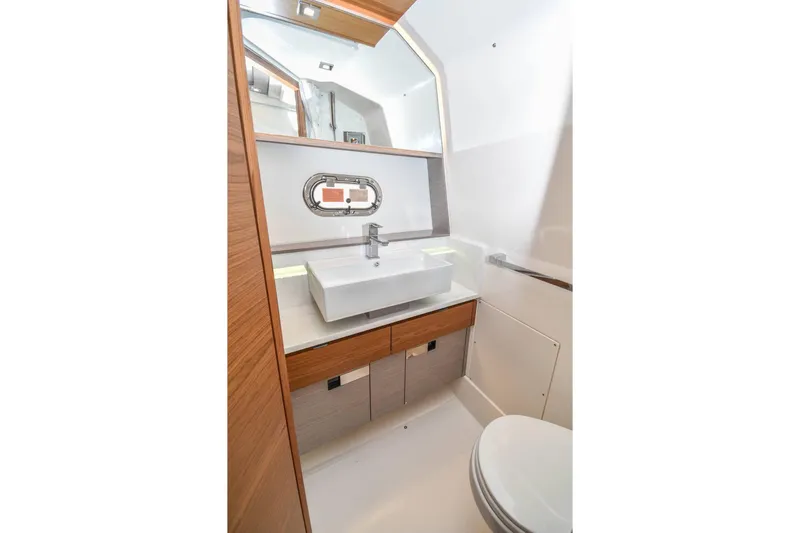 Slide: The Image of Luxurious bathroom interior of 2024 Tiara Yachts 38 LS, featuring modern sink and mirror. - 29