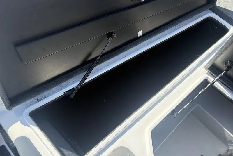 Slide: The Image of Open storage compartment of a 2004 Stratos 285 Pro XL boat. - 12