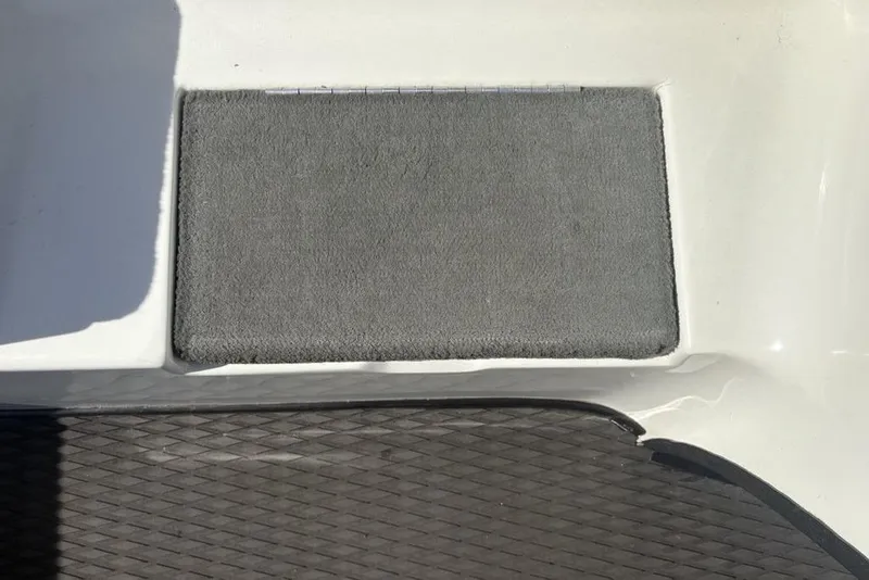 Slide: The Image of Gray carpeted step on a 2004 Stratos 285 Pro XL boat deck. - 14