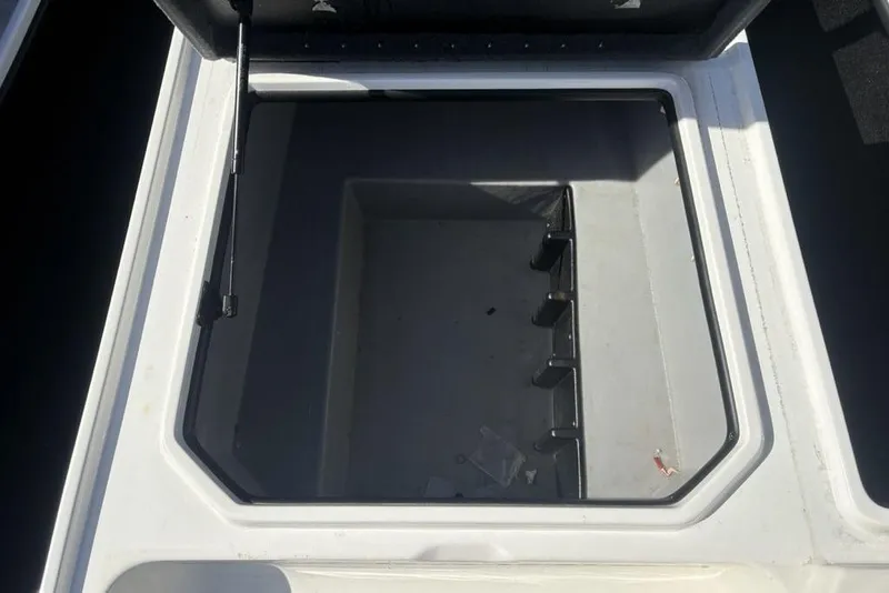 Slide: The Image of Open storage compartment in 2004 Stratos 285 Pro XL boat. - 15