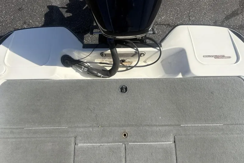 Slide: The Image of 2004 Stratos 285 Pro XL boat deck with composite construction and motor cables. - 23