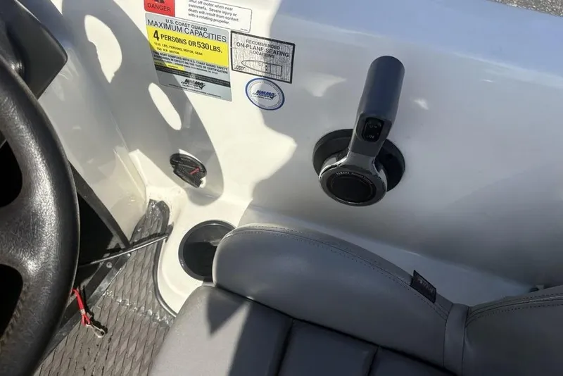 Slide: The Image of Interior of 2004 Stratos 285 Pro XL boat showing controls and seating. - 24