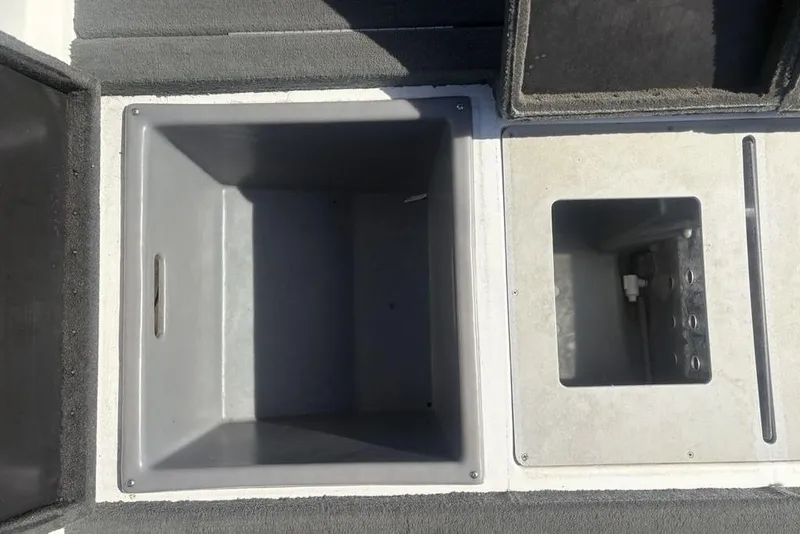 Slide: The Image of 2004 Stratos 285 Pro XL boat storage compartments, open and empty. - 25