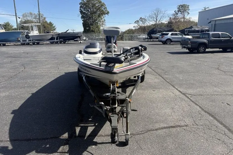 Slide: The Image of 2004 Stratos 285 Pro XL boat on trailer in parking lot, sunny day. - 3