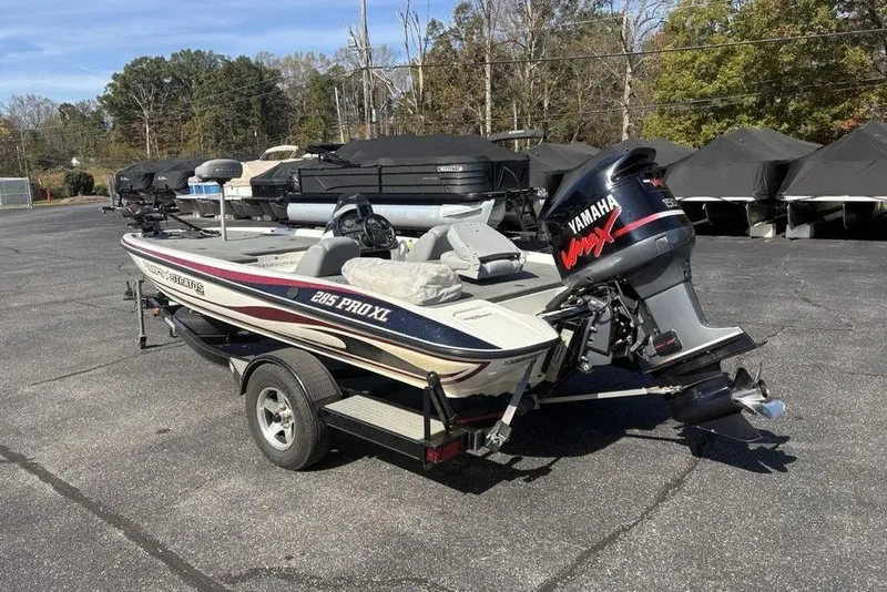 Slide: The Image of 2004 Stratos 285 Pro XL boat with Yamaha VMAX engine on trailer in parking lot. - 4