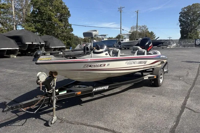 Slide: The Image of 2004 Stratos 285 Pro XL boat on trailer in outdoor lot. - 7
