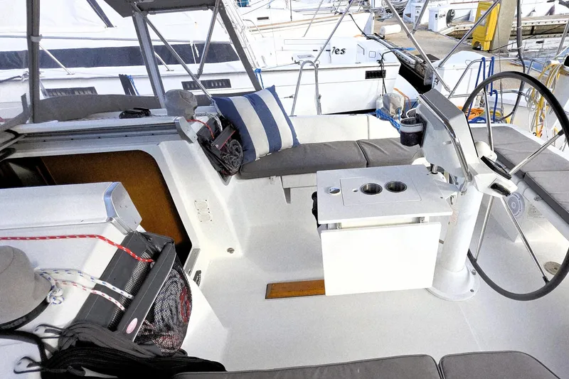 Slide: The Image of 2013 Beneteau Oceanis 37 yacht cockpit with steering wheel and seating area. - 12